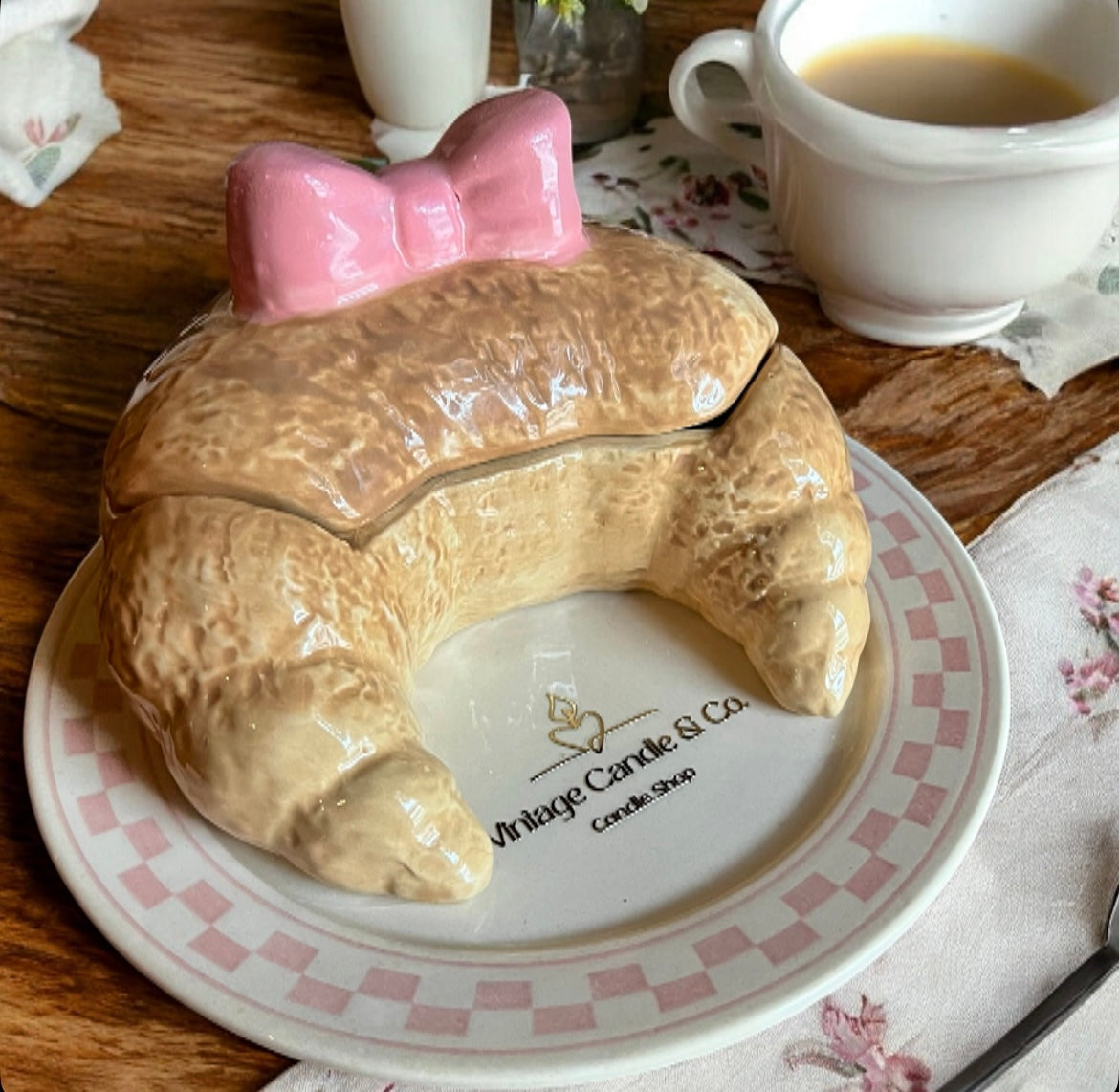 Croissant with lid on a plate
